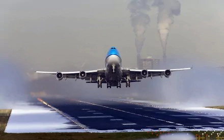 HD PC desktop wallpaper showcasing a large aircraft ascending from a runway, capturing the power and motion of the vehicle in flight.