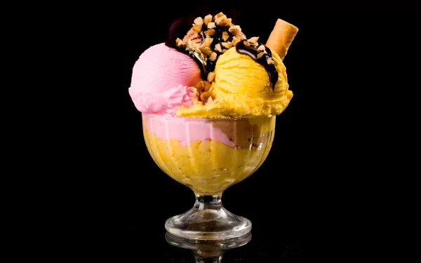 A vibrant ice cream sundae featuring scoops of pink and yellow ice cream, topped with chocolate sauce, nuts, and a crispy wafer, against a sleek black background. 4K Ultra HD resolution.