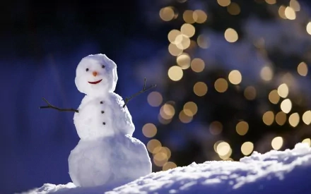 HD desktop wallpaper featuring a photography shot of a cheerful snowman with bokeh lights glowing softly in the dark background.