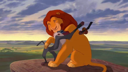HD wallpaper of Simba with Rafiki on Pride Rock from The Lion King (1994).