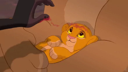 HD wallpaper of Simba cuddling with Mufasa's paw from The Lion King (1994).