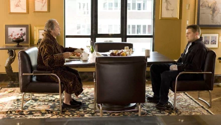 HD wallpaper background from The Departed featuring a scene with characters portrayed by Jack Nicholson and Leonardo DiCaprio sitting at a table.