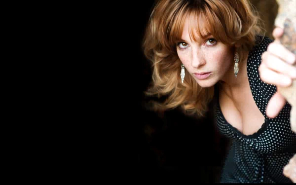 HD PC desktop wallpaper featuring a close-up of a woman with light brown hair and a polka-dot top, identified as Vica Kerekes, against a dark background.