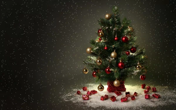 A beautifully decorated Christmas tree with red and gold ornaments stands surrounded by small gifts, set against a snowy backdrop, creating a festive holiday atmosphere.