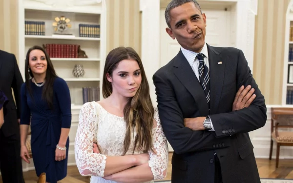 HD desktop wallpaper featuring a person mimicking a playful expression alongside another smiling person in a formal setting.