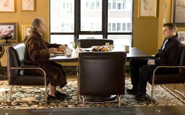 HD wallpaper background from The Departed featuring a scene with characters portrayed by Jack Nicholson and Leonardo DiCaprio sitting at a table.