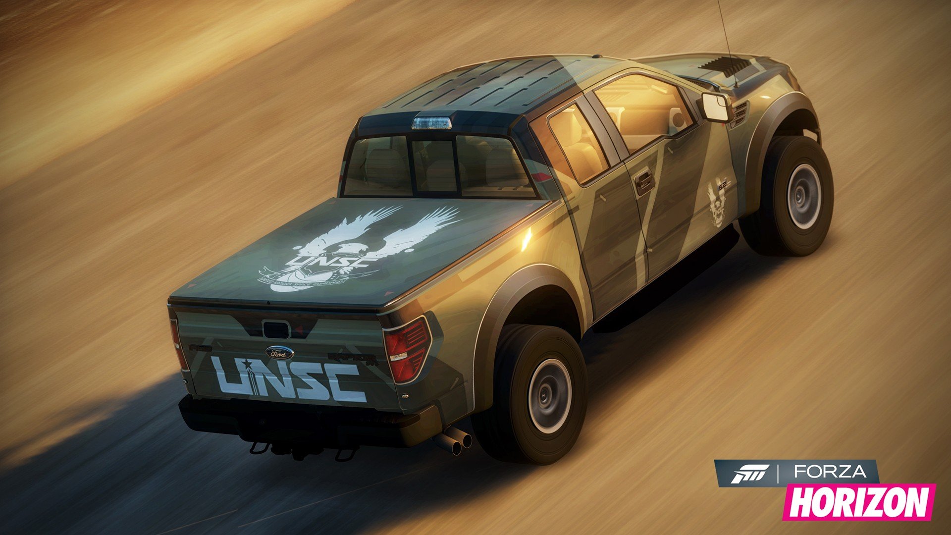 HD PC desktop wallpaper featuring a rugged Forza Horizon video game truck with a UNSC logo, captured in dynamic motion on a dirt road.