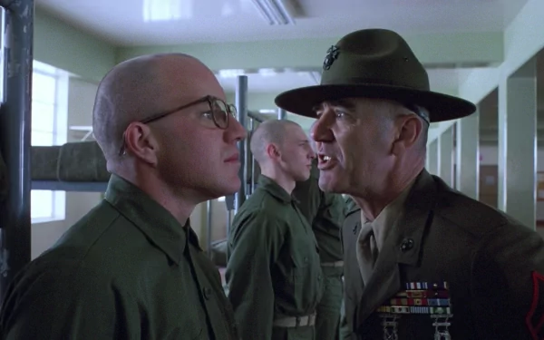 HD PC desktop wallpaper from the movie Full Metal Jacket, featuring an intense confrontation between a drill instructor and a recruit in military barracks.