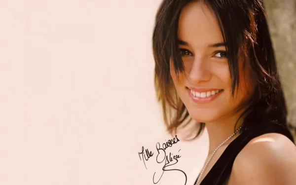 HD PC desktop wallpaper featuring a close-up of Alizée smiling, with a soft background, capturing the essence of music and her charming presence.