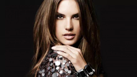HD PC desktop wallpaper featuring celebrity Alessandra Ambrosio with long hair, wearing a sequined top and a stylish watch against a dark background.