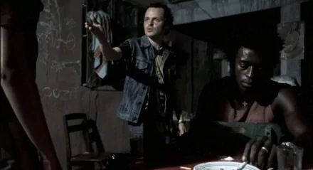 HD desktop wallpaper featuring a tense scene from the movie City of God, with two characters in a dimly lit room.