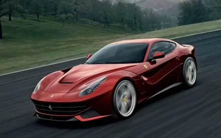 Red Ferrari F12berlinetta on the move, showcased as a sleek HD desktop wallpaper and background.