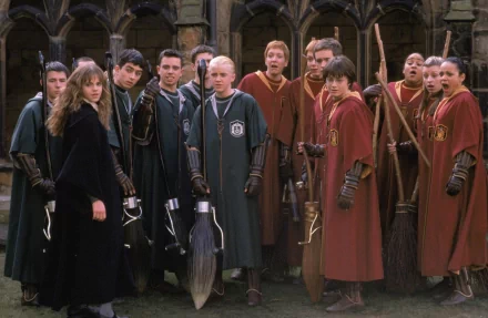 HD wallpaper featuring characters from Harry Potter and the Chamber of Secrets with brooms, in Hogwarts attire, for desktop background.