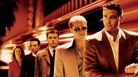 HD desktop wallpaper featuring Ocean's Eleven cast with Brad Pitt, George Clooney, Matt Damon, and Julia Roberts in a stylized group pose.