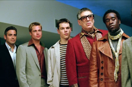 HD wallpaper of 'Ocean's Eleven' featuring George Clooney, Brad Pitt, Matt Damon, Don Cheadle, and Elliott Gould.