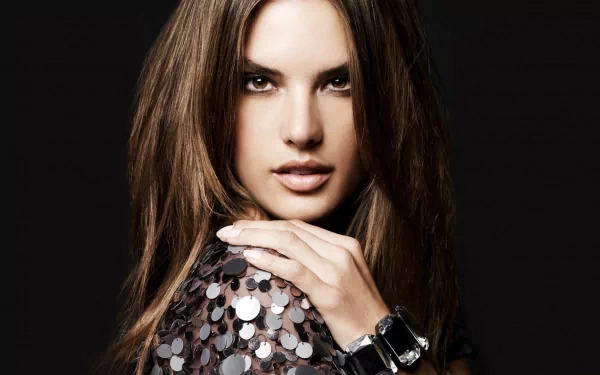 HD PC desktop wallpaper featuring celebrity Alessandra Ambrosio with long hair, wearing a sequined top and a stylish watch against a dark background.