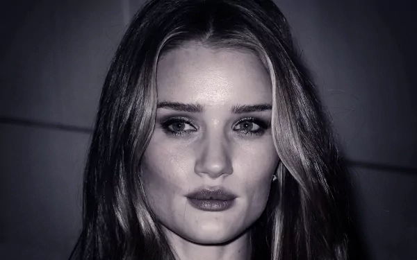 HD PC desktop wallpaper featuring a close-up portrait of celebrity Rosie Huntington-Whiteley with soft lighting and a dark background.