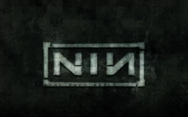HD PC desktop wallpaper featuring the distressed Nine Inch Nails (NIN) logo on a dark textured background, representing the iconic industrial music band.