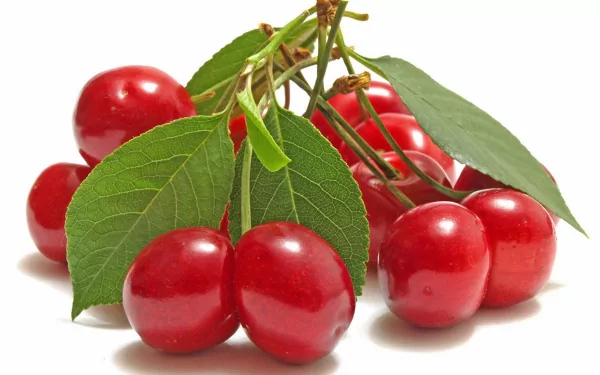 HD desktop wallpaper featuring a close-up of vibrant red cherries with green leaves on a white background, highlighting fresh food imagery.