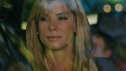 HD desktop wallpaper featuring Sandra Bullock in a scene from the movie The Blind Side, showcasing her emotional expression through a window reflection.