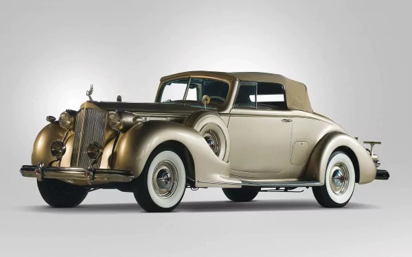 HD desktop wallpaper of a classic Packard Twelve Coupe, showcasing its elegant two-tone design and vintage style against a plain background.