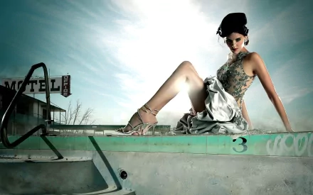 A striking HD wallpaper featuring Maggie Grace, showcasing her elegance as she poses by an abandoned motel pool under a dramatic sky.