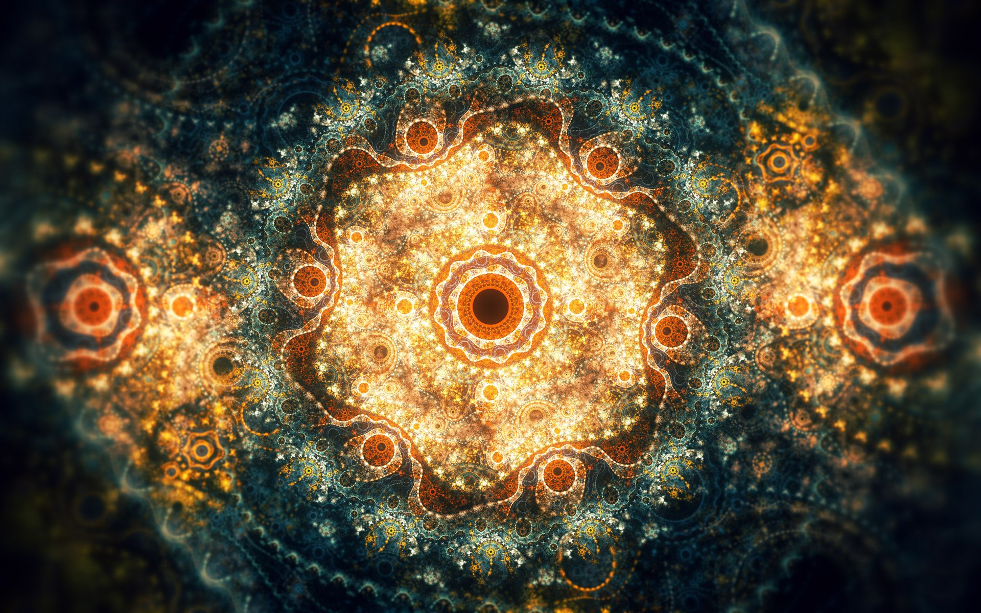 HD PC desktop wallpaper featuring an abstract fractal design with intricate, glowing patterns radiating from the center in warm tones against a dark background.
