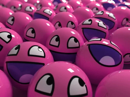 HD desktop wallpaper featuring a gathering of funny, smiley pink balls with various delighted expressions, creating a cheerful background.