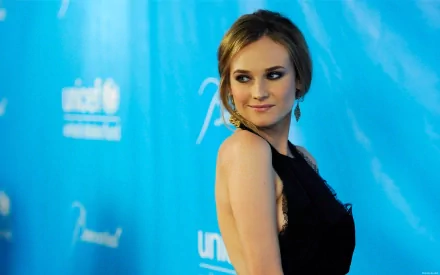 HD desktop wallpaper featuring celebrity Diane Kruger posing against a blue background with event logos.