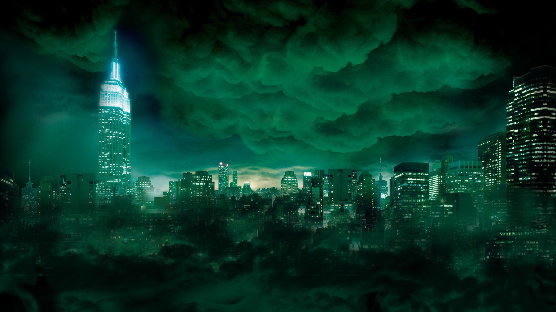 A dramatic view of Manhattan's skyline at night, showcasing the Empire State Building illuminated against a backdrop of green clouds, creating a striking, atmospheric scene.