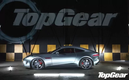 HD desktop wallpaper from Top Gear featuring a sleek sports car under spotlights with the show's logo overlay.