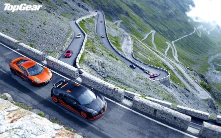 HD wallpaper featuring Top Gear's sports cars driving on a winding mountain road with the show's logo at the top left.