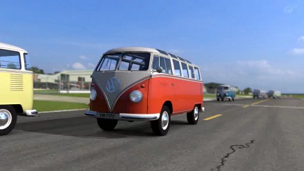 HD desktop wallpaper from Gran Turismo 5 featuring a classic red and white Volkswagen bus on a racetrack.
