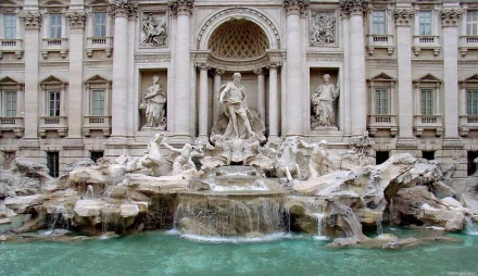 A stunning HD wallpaper showcasing a majestic palace facade, featuring intricate sculptures and a grand fountain, bringing an elegant, man-made beauty to your desktop background.
