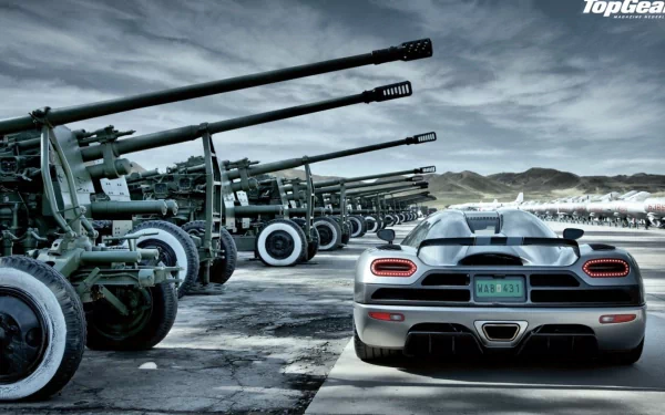HD wallpaper with a silver Koenigsegg hypercar in front of a row of Mikoyan-Gurevich MiG-15s, branded with Top Gear logo.