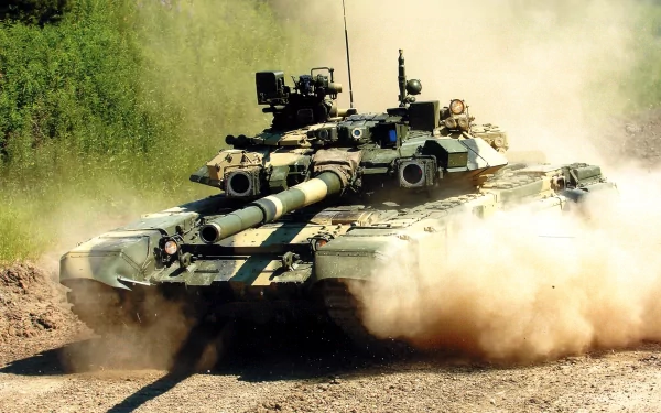 HD PC desktop wallpaper featuring a T-90 military tank advancing through a dusty terrain with trees in the background.