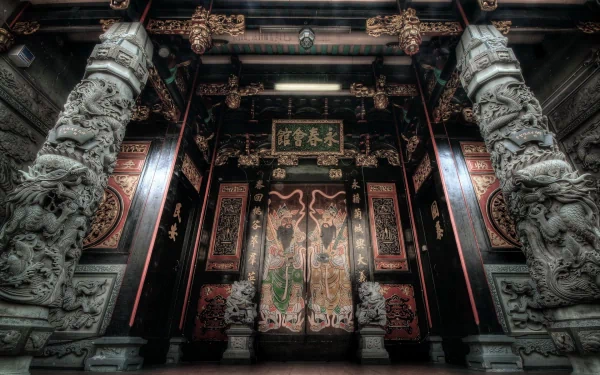 HD PC desktop wallpaper featuring intricate oriental architecture with detailed stone pillars and ornate wooden doors in a dimly lit traditional setting.