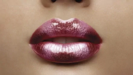 Close-up of glistening lips, showcasing a soft, glossy finish. This HD image serves as an attractive desktop wallpaper and background.