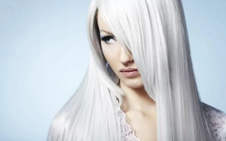 HD PC desktop wallpaper featuring a close-up portrait of a woman with long, straight, silver hair partially covering her face against a soft blue background.
