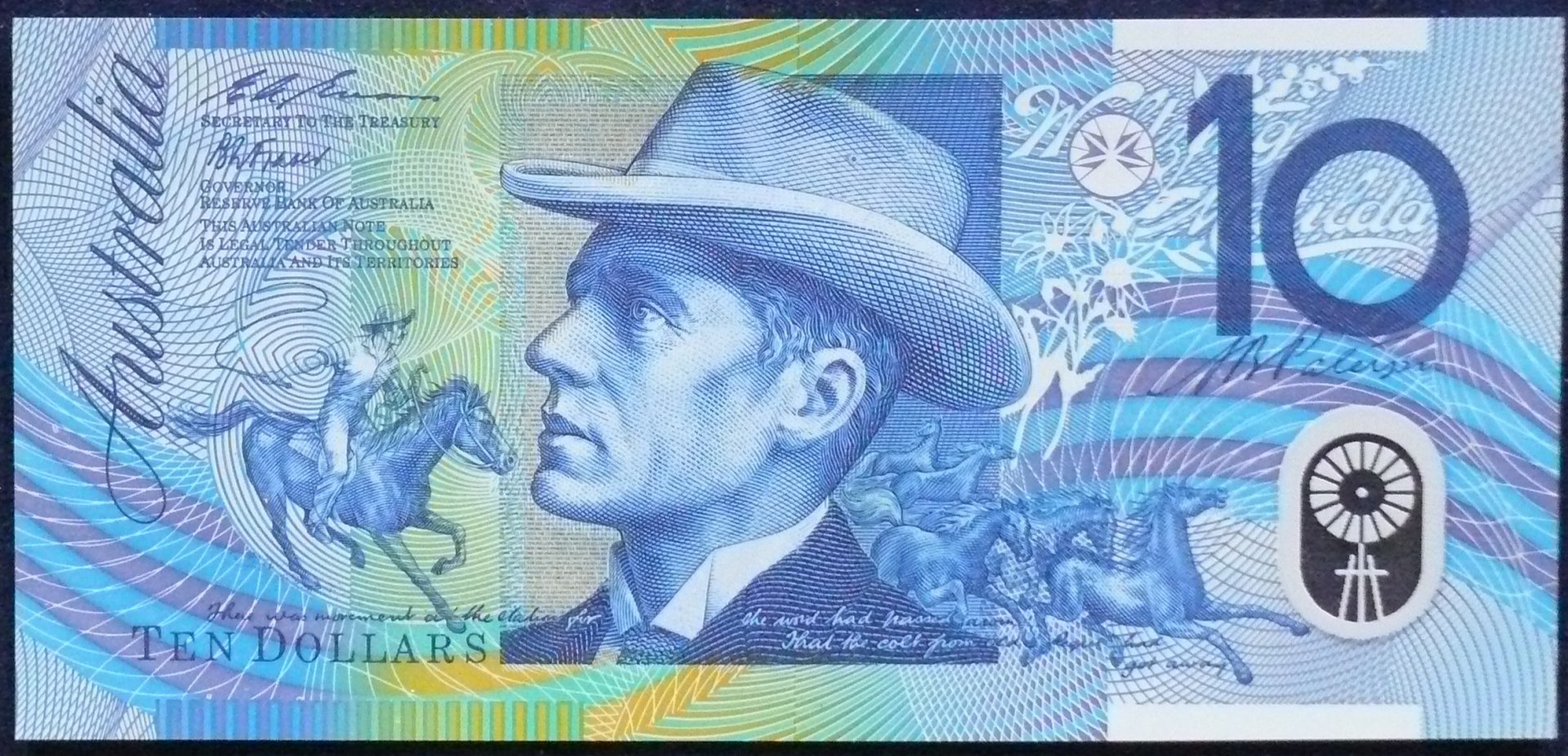 HD desktop wallpaper showing a detailed, man-made design featuring the Australian Dollar with a portrait of a man in a hat and horses in motion.
