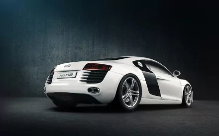 HD desktop wallpaper showcasing a sleek white Audi R8 sports car against a dark textured background.