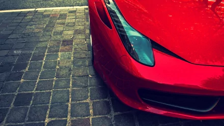 HD PC desktop wallpaper: close-up of a red Ferrari 612 GTO vehicle's front corner on cobblestone pavement.