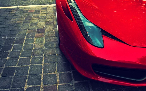 HD PC desktop wallpaper: close-up of a red Ferrari 612 GTO vehicle's front corner on cobblestone pavement.