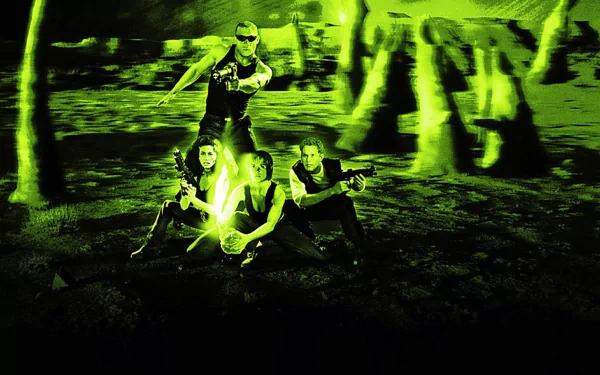 A dramatic HD wallpaper from the movie Pitch Black, featuring four protagonists in a vibrant green setting, showcasing a tense standoff amid an otherworldly landscape.