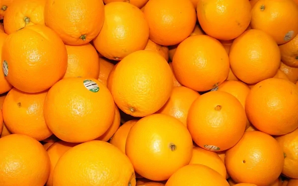 HD close-up image of vibrant orange fruits, highlighting their bright color and texture, designed as a vivid desktop wallpaper and background.
