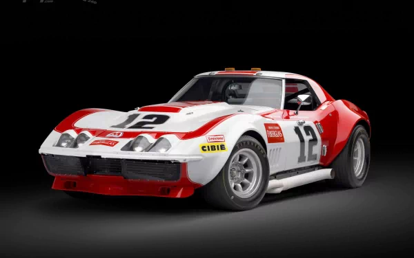 HD desktop wallpaper featuring a Chevrolet Corvette L88 race car in red and white with number 12 on the doors and hood against a black background.