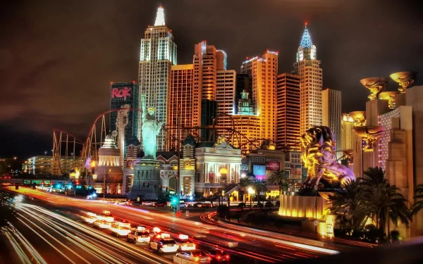 Vibrant night scene of Las Vegas, showcasing illuminated skyscrapers and lively traffic, captured as a stunning HD desktop wallpaper and background.
