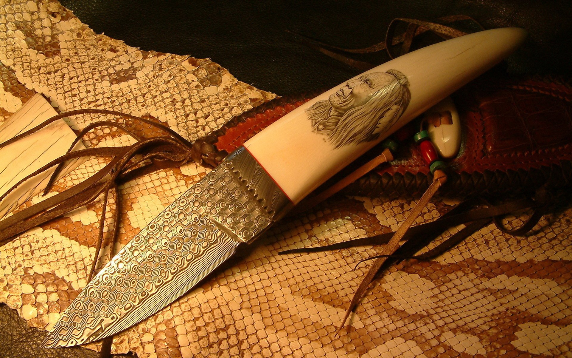 A beautifully crafted knife with intricate detailing rests on a textured surface, showcasing its striking design. This HD image serves as a captivating PC desktop wallpaper.