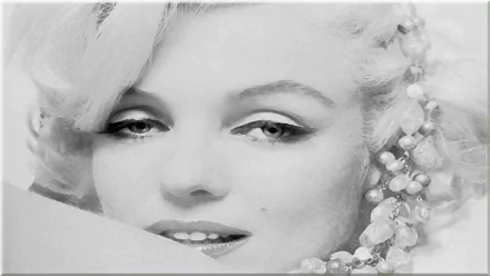 A stunning black-and-white HD wallpaper featuring a close-up of blonde celebrity Marilyn Monroe, capturing her iconic beauty and timeless charm.