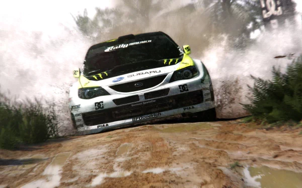 HD PC desktop wallpaper featuring a rally car racing on a muddy track from the video game Colin McRae: Dirt 2.